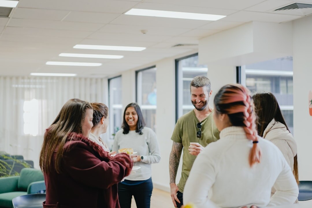 Diverse adults in a communication workshop sitting in a circle